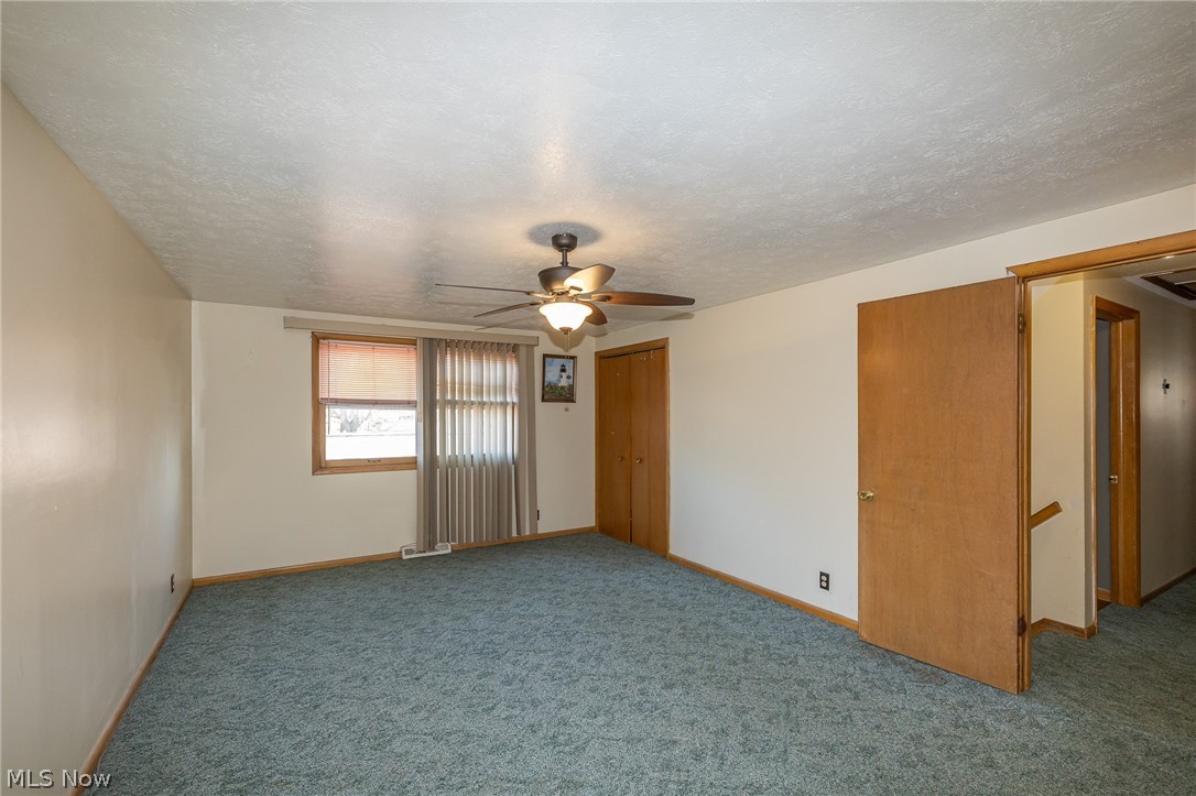 490 Mapleview Drive Seven Hills, OH 44131 - Photo 18 of 50 Master bedroom ceiling fan, and carpet floors