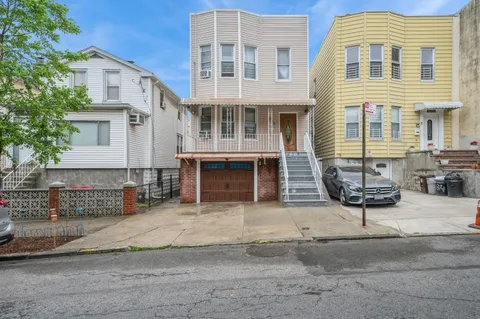 a front view of a building with glass windows and door