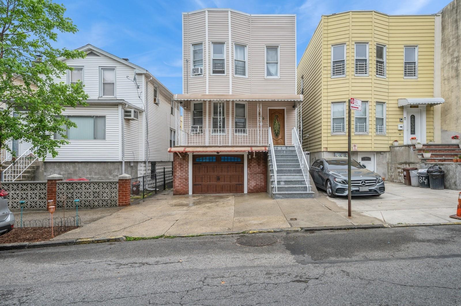 a front view of a building with glass windows and door