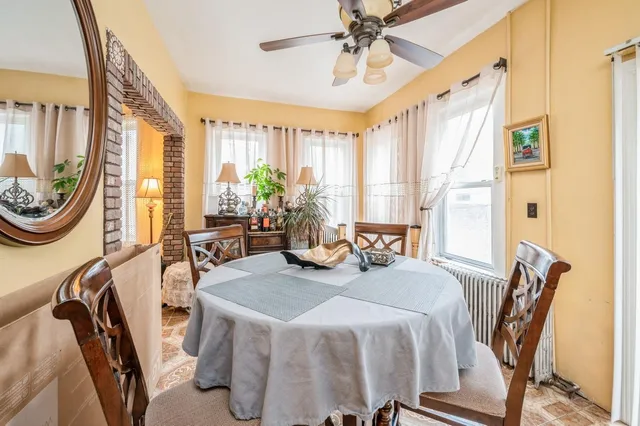 a view of a dining room with furniture window and outside view