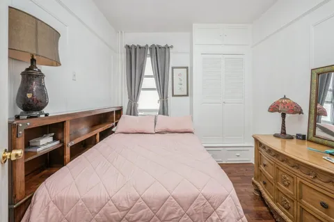 a bedroom with a bed and furniture