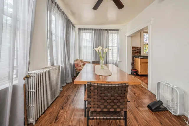 a view of a livingroom with furniture window and wooden floor