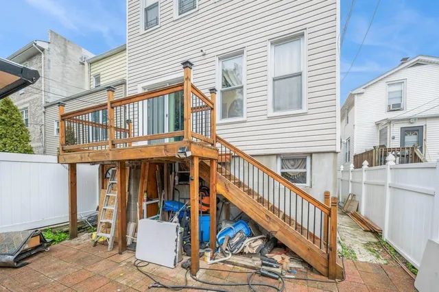 a view of a house with wooden stairs