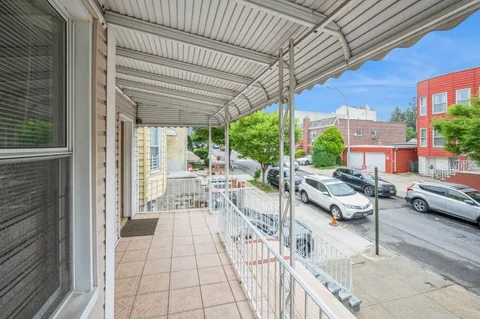 a view of a patio with couches table and chairs and potted plants