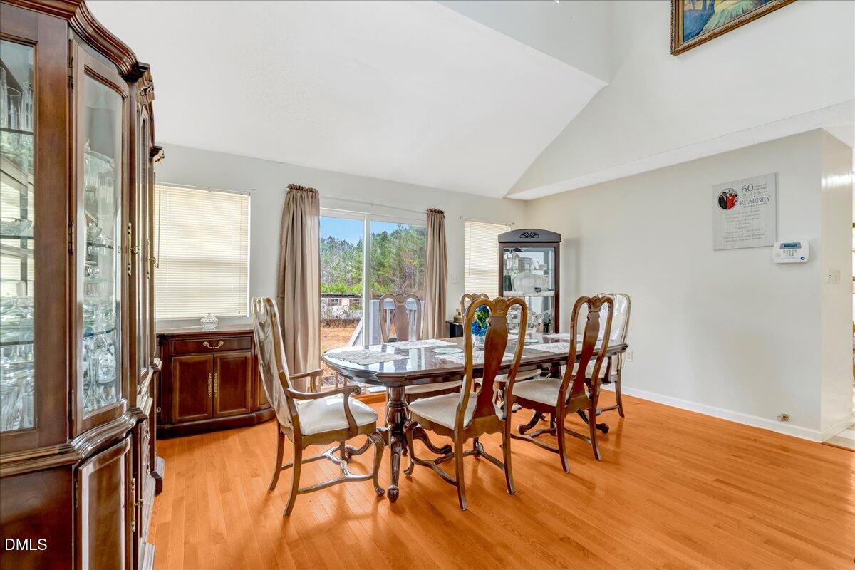 656 No Bottom Road Warrenton, NC 27589 - Photo 13 of 26 a view of a dining room with furniture window and wooden floor