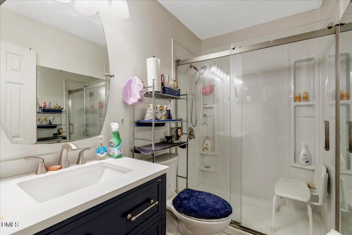 656 No Bottom Road Warrenton, NC 27589 - Photo 15 of 26 a bathroom with a sink a toilet and shower