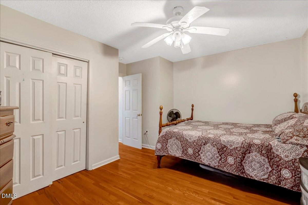656 No Bottom Road Warrenton, NC 27589 - Photo 17 of 26 a bedroom with a bed and a chandelier