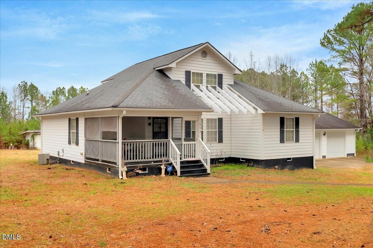 656 No Bottom Road Warrenton, NC 27589 - Photo 2 of 26 a front view of a house with a yard and balcony