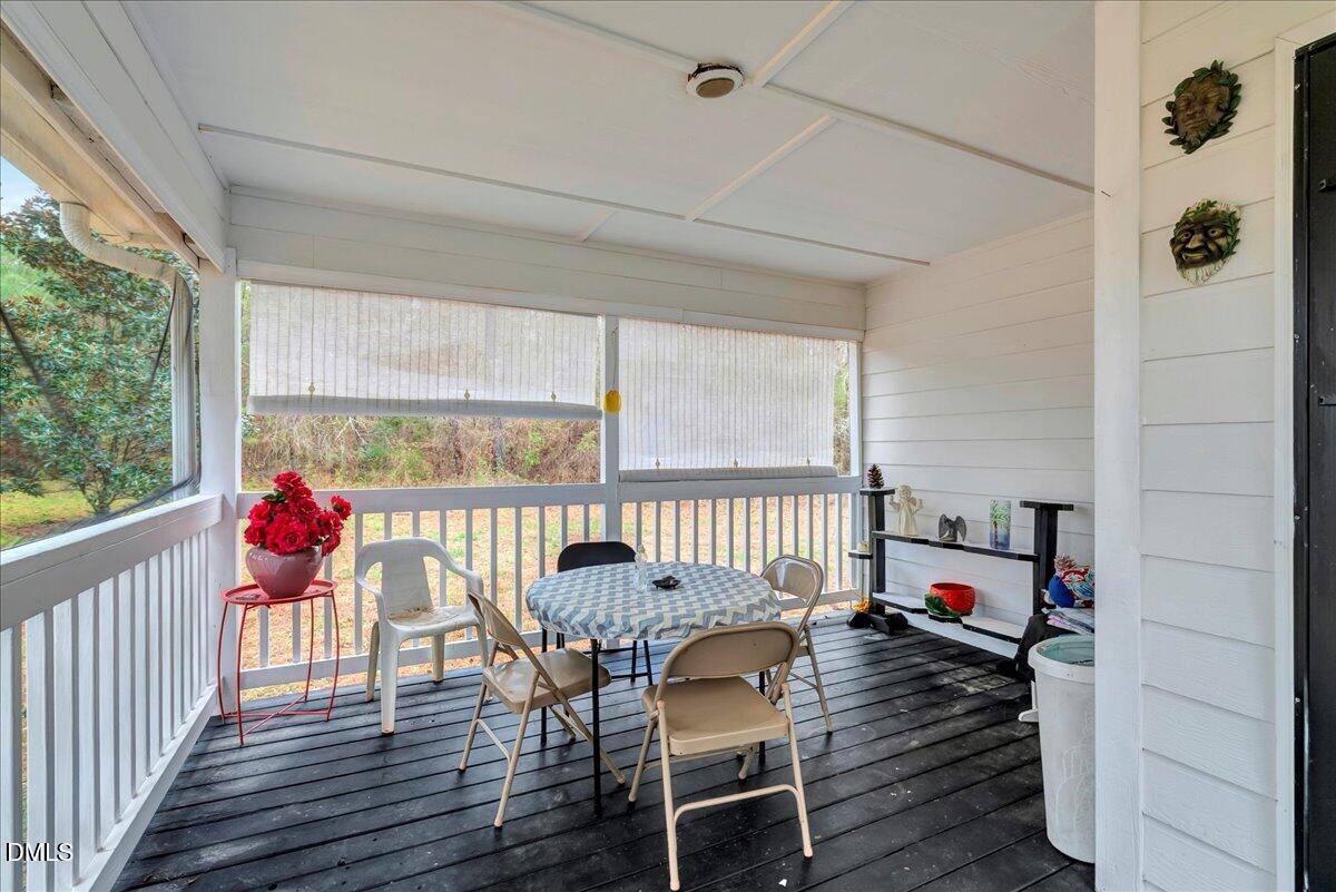 656 No Bottom Road Warrenton, NC 27589 - Photo 5 of 26 a view of a dining room with furniture window and wooden floor