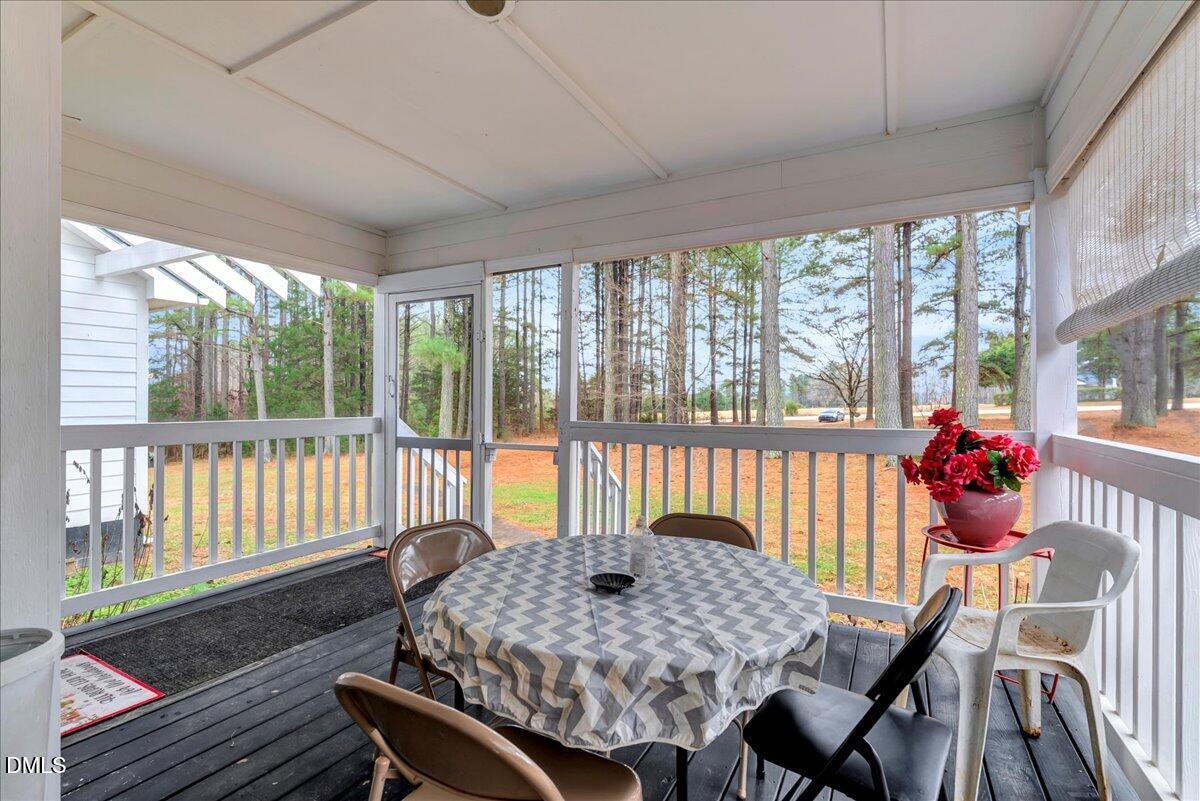 656 No Bottom Road Warrenton, NC 27589 - Photo 6 of 26 a view of a dining room with furniture window and outside view