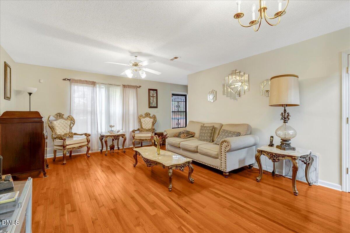656 No Bottom Road Warrenton, NC 27589 - Photo 8 of 26 a living room with furniture lamps and wooden floor