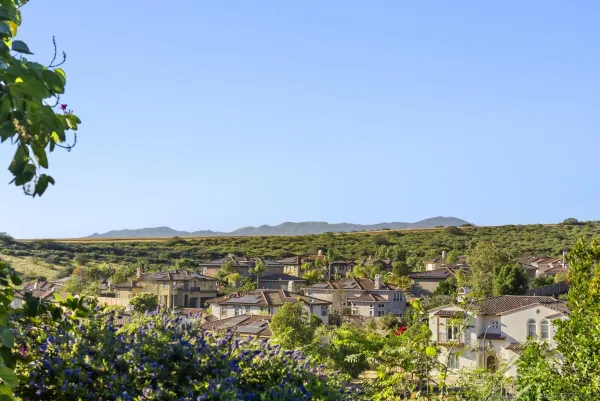 a view of a roof deck with table and chairs with a yard