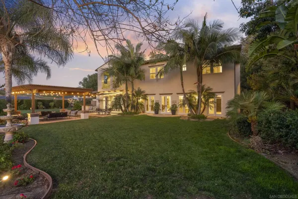 a view of yard with swimming pool and furniture