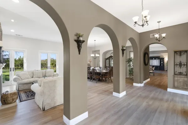 a kitchen with stainless steel appliances kitchen island granite countertop a kitchen island hardwood floor and a sink