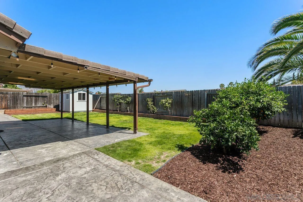 12805 Pinefield Road Poway, CA 92064 - Photo 22 of 31 a view of a house with backyard and swimming pool