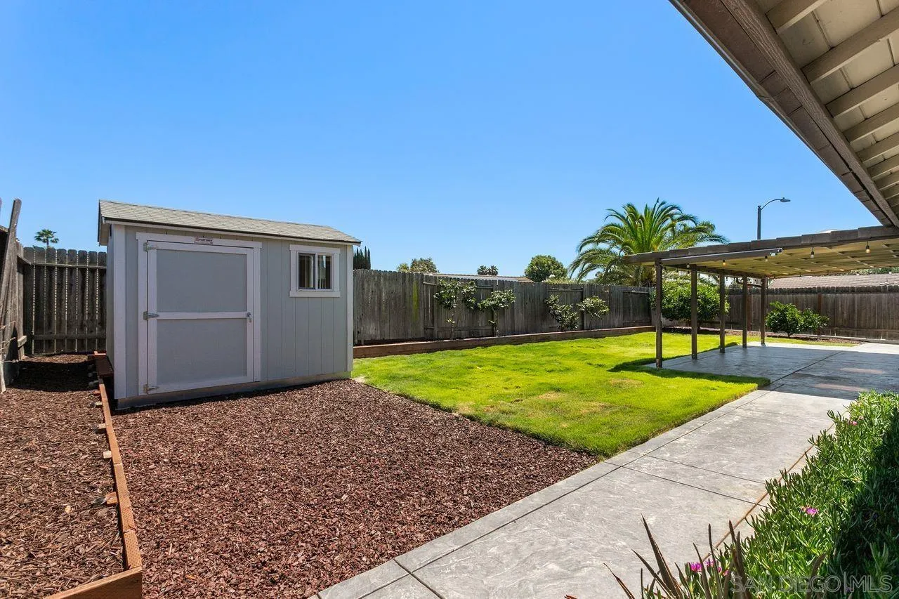 12805 Pinefield Road Poway, CA 92064 - Photo 24 of 31 a view of backyard with swimming pool and seating space