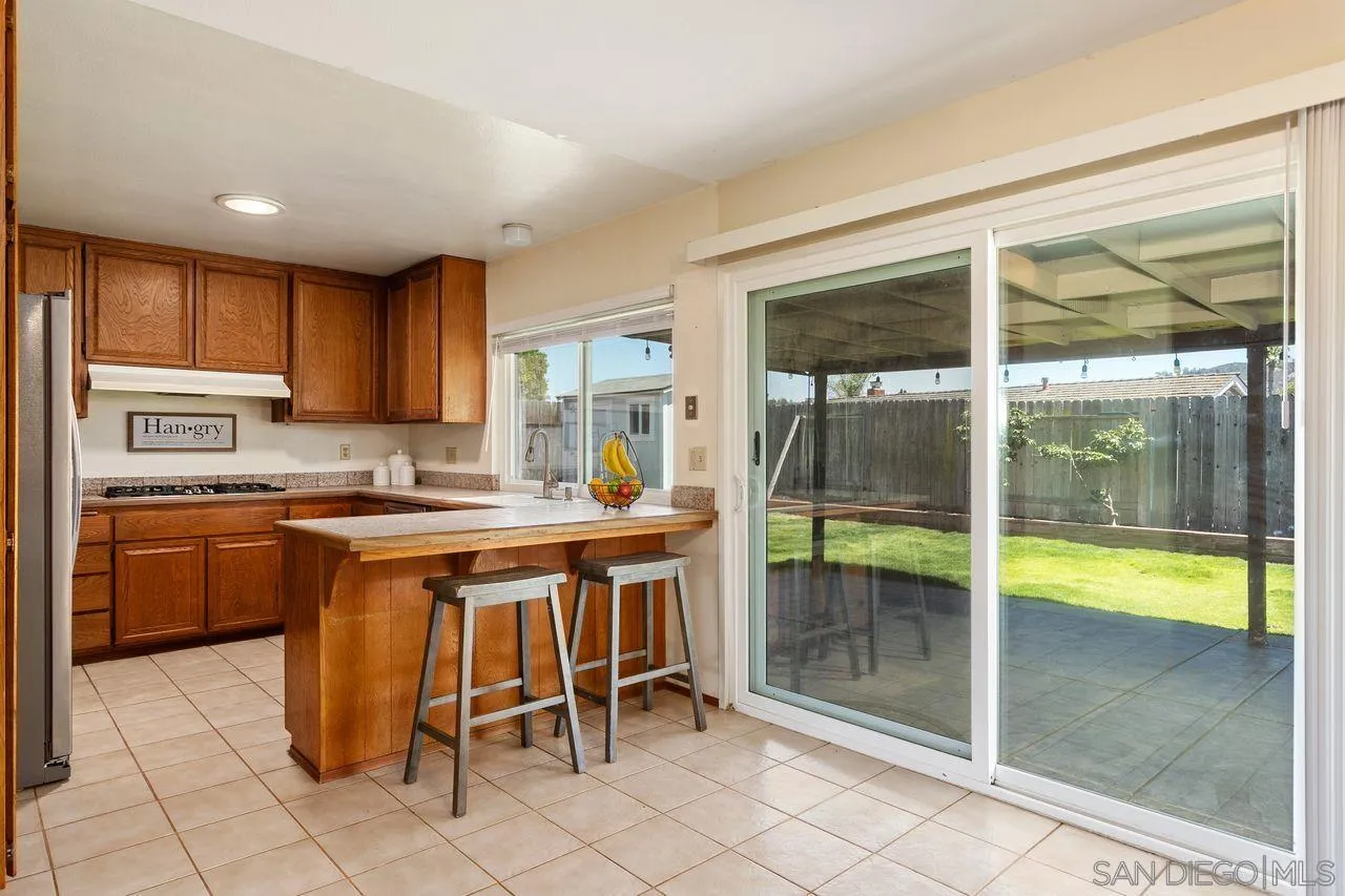 12805 Pinefield Road Poway, CA 92064 - Photo 8 of 31 a kitchen with a sink and a stove top oven