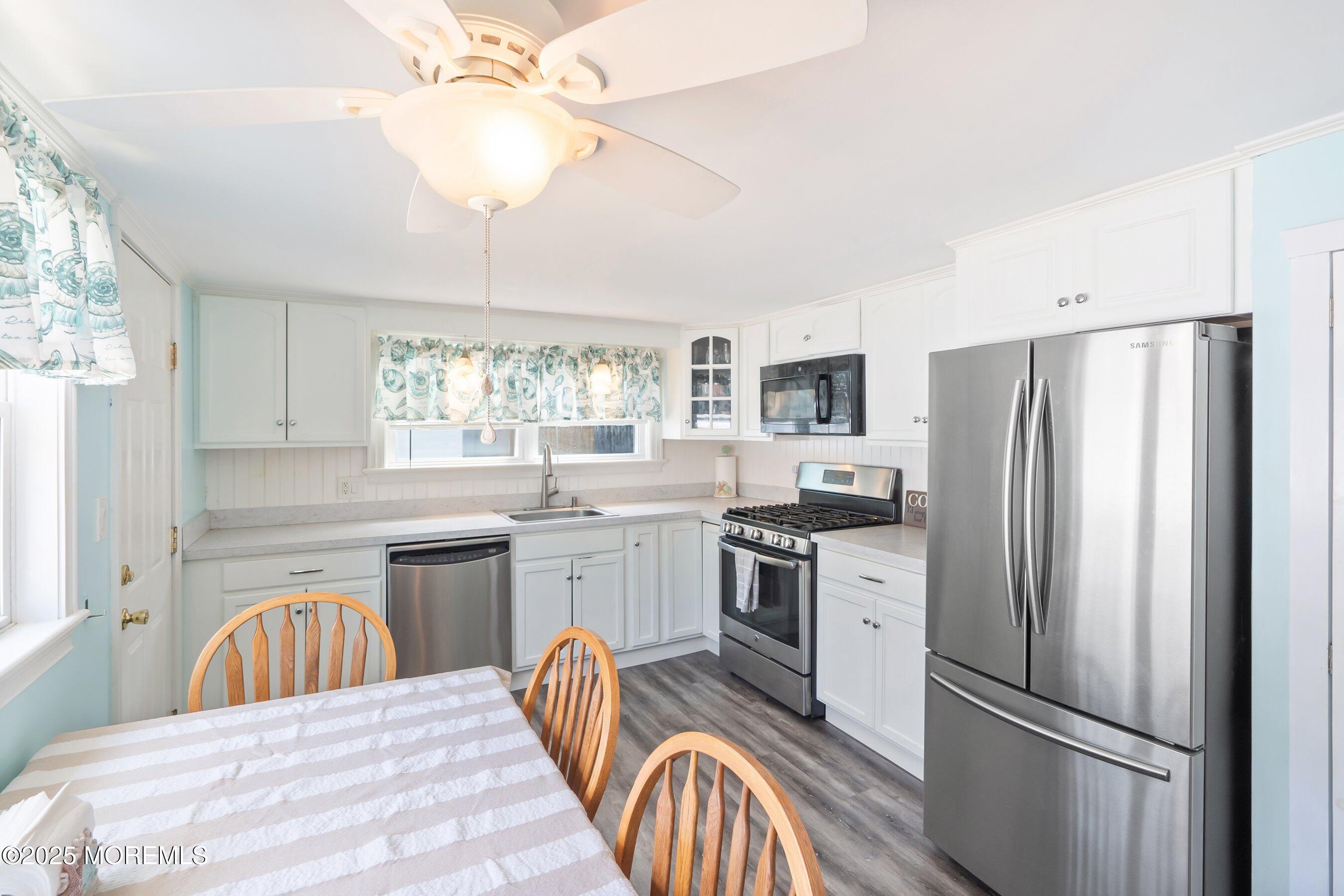 54 Buckingham Road Brick, NJ 08723 - Photo 11 of 35 a kitchen with a refrigerator sink and stove