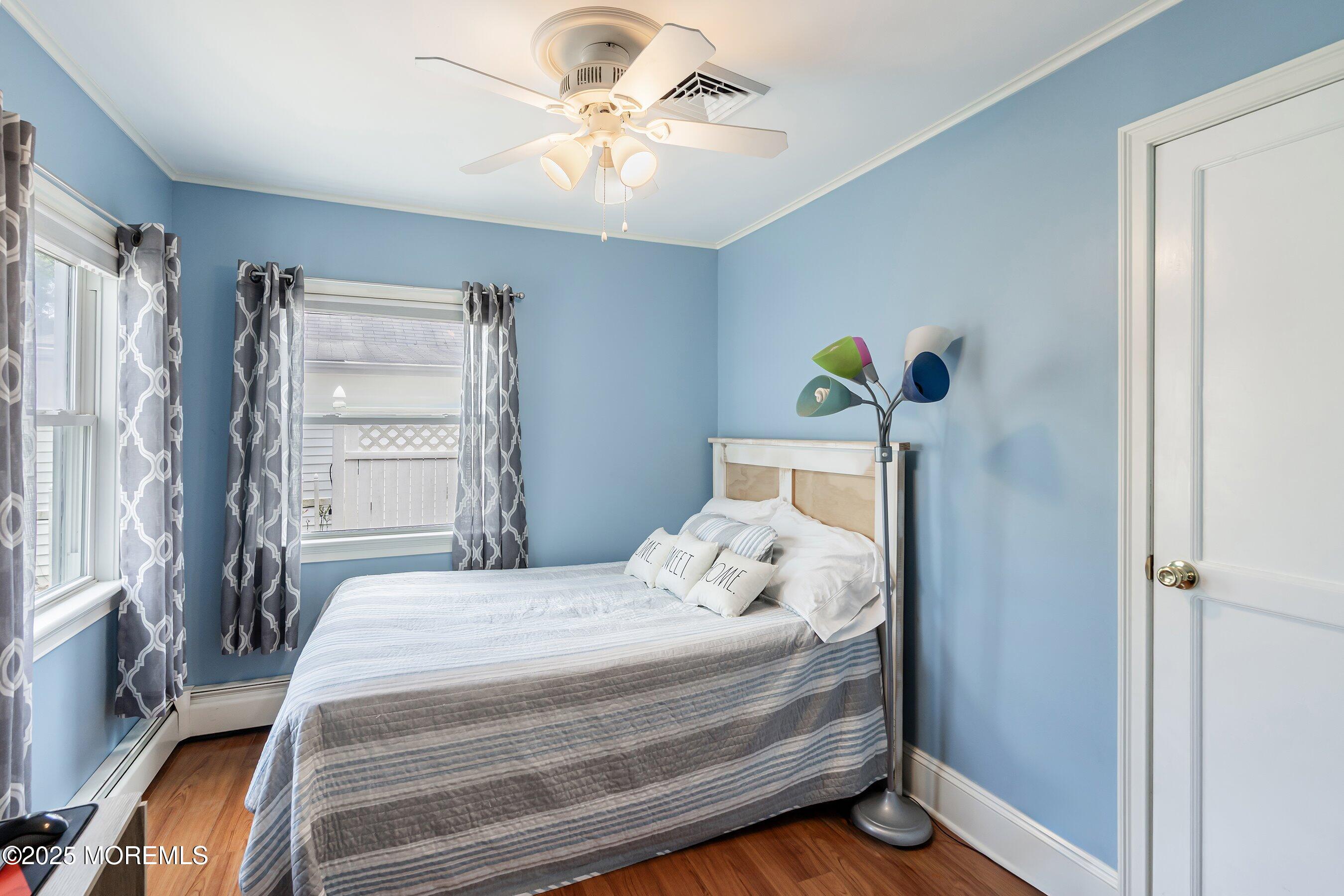 54 Buckingham Road Brick, NJ 08723 - Photo 7 of 35 a bedroom with a bed and a chandelier
