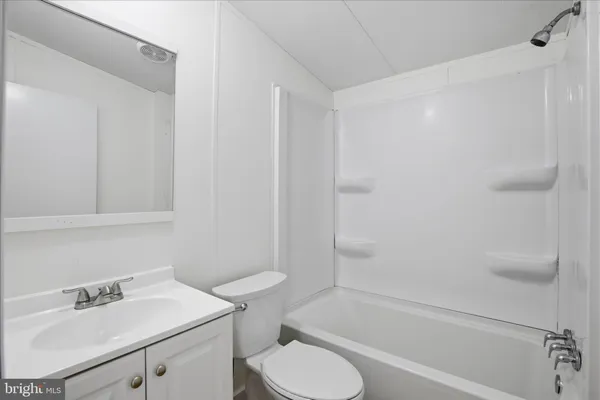 a bathroom with a sink toilet and bathtub