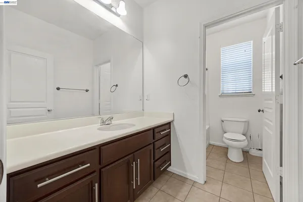 a bathroom with a toilet and bathtub