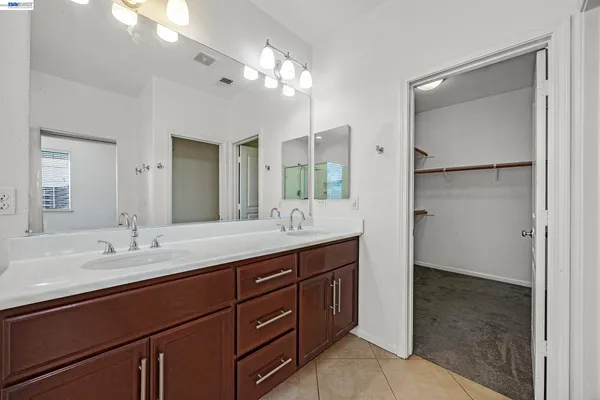a bath tub sitting next to a white sink