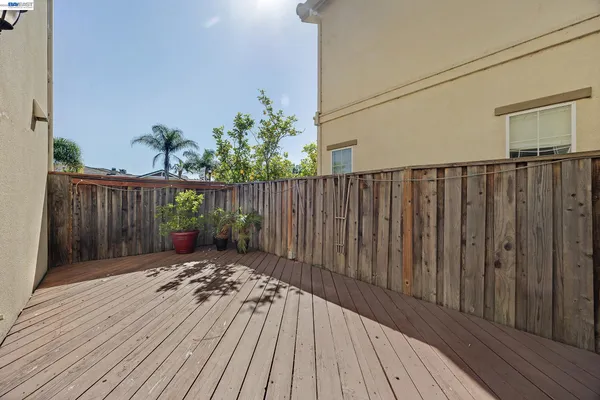 a view of wooden floor with a wooden fence