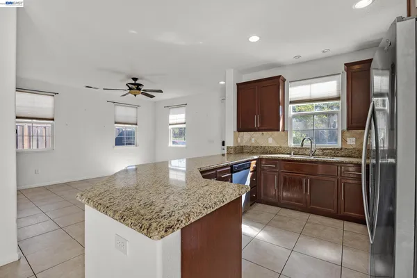 a kitchen with a sink and a refrigerator