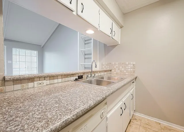 a bathroom with a sink and a vanity