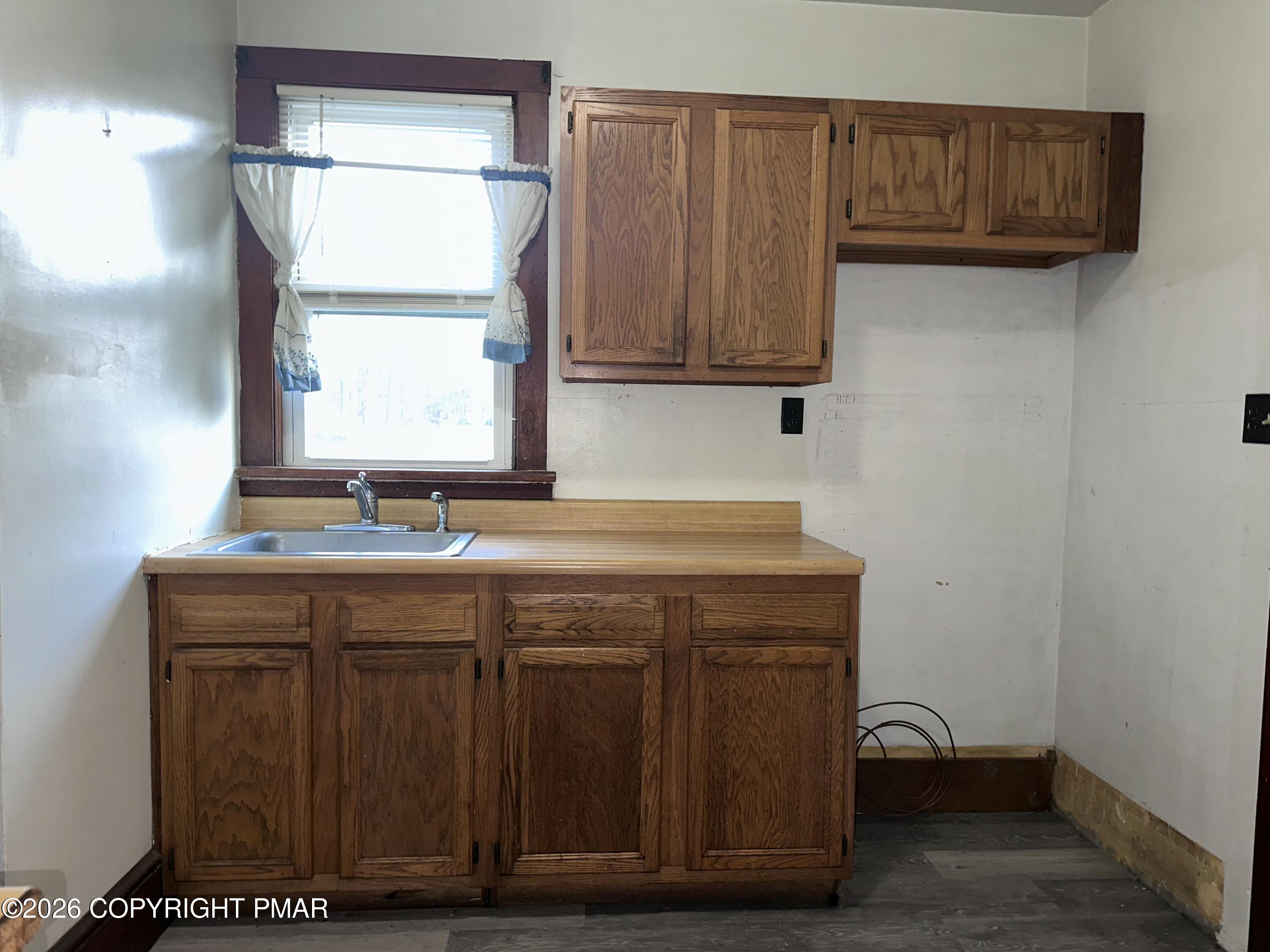 349 Shine Hill Road Henryville, PA 18332 - Photo 11 of 25 a utility room with granite countertop a sink and a wooden floor