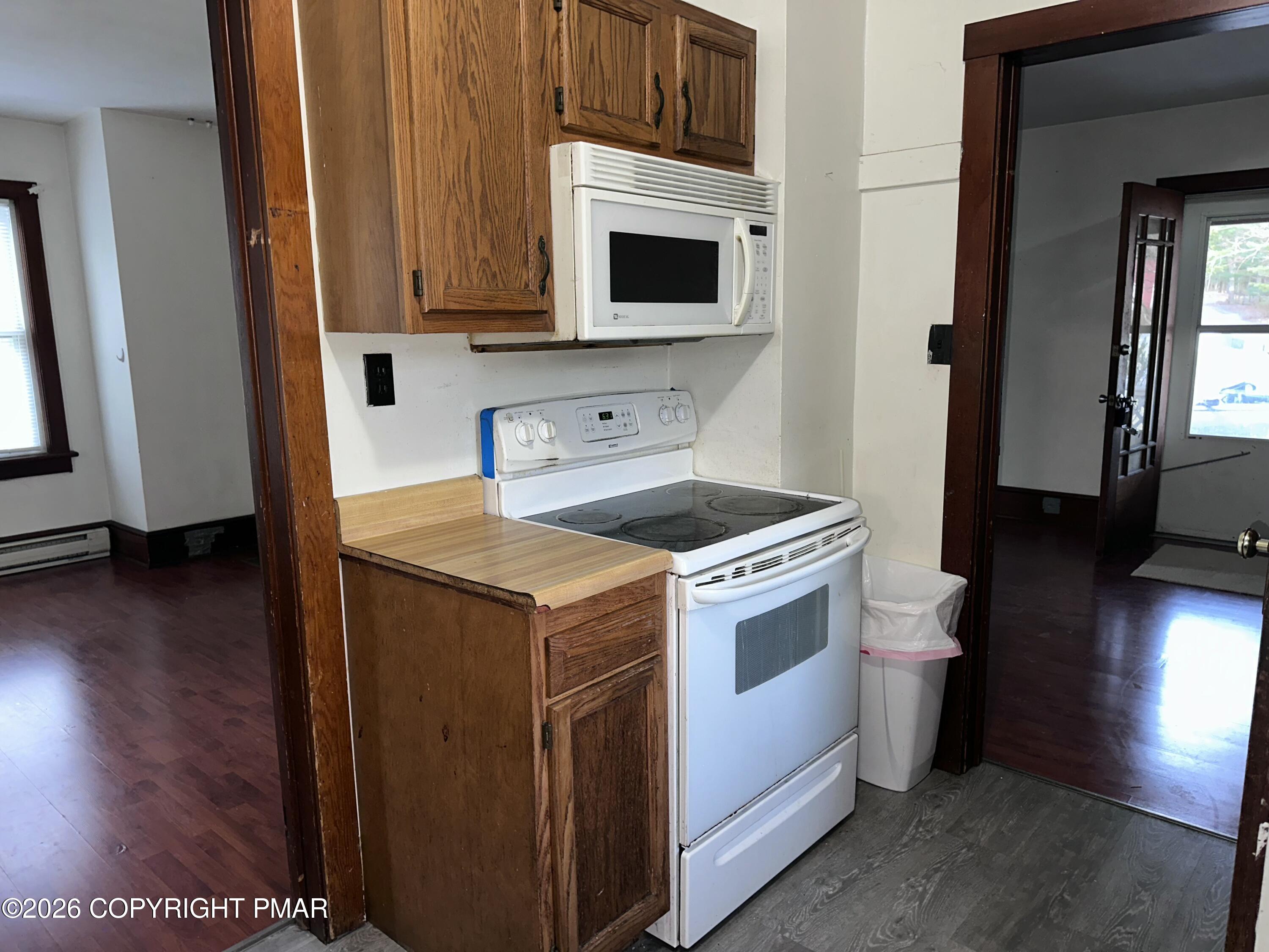 349 Shine Hill Road Henryville, PA 18332 - Photo 14 of 25 a kitchen with stainless steel appliances a stove a microwave and a hard wood floors
