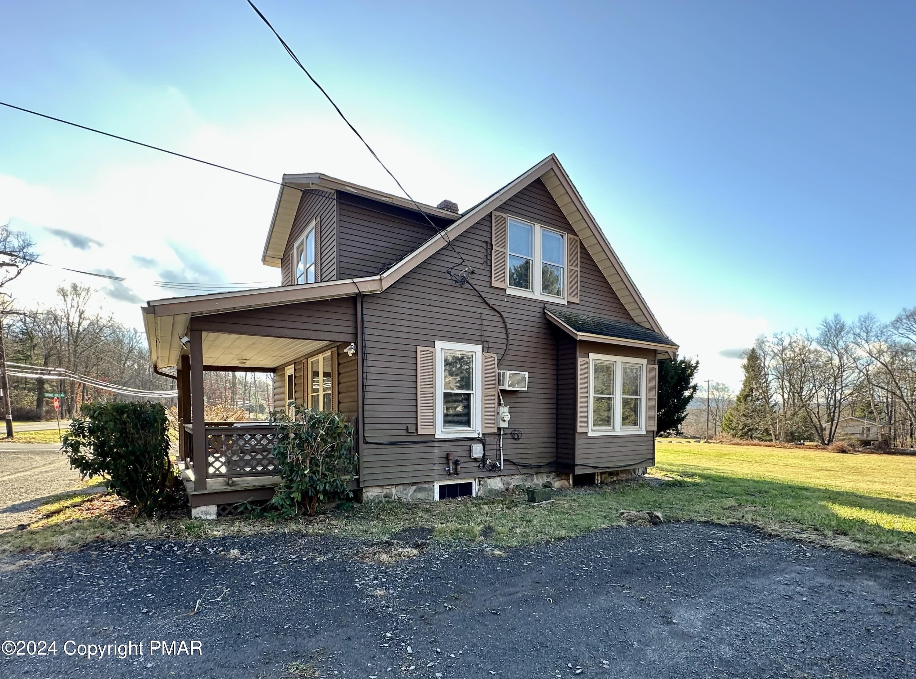 349 Shine Hill Road Henryville, PA 18332 - Photo 2 of 25 a view of a house with a backyard