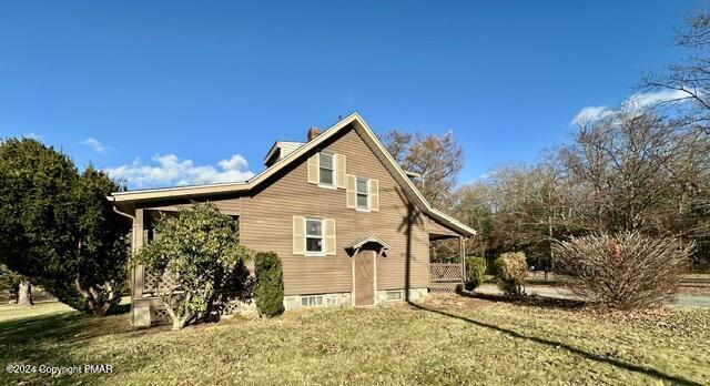 349 Shine Hill Road Henryville, PA 18332 - Photo 21 of 25 a view of a house with a yard