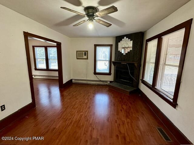349 Shine Hill Road Henryville, PA 18332 - Photo 6 of 25 a view of empty room with wooden floor and fan