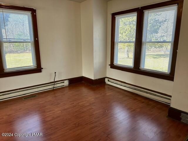 349 Shine Hill Road Henryville, PA 18332 - Photo 9 of 25 a view of an empty room with wooden floor and a window
