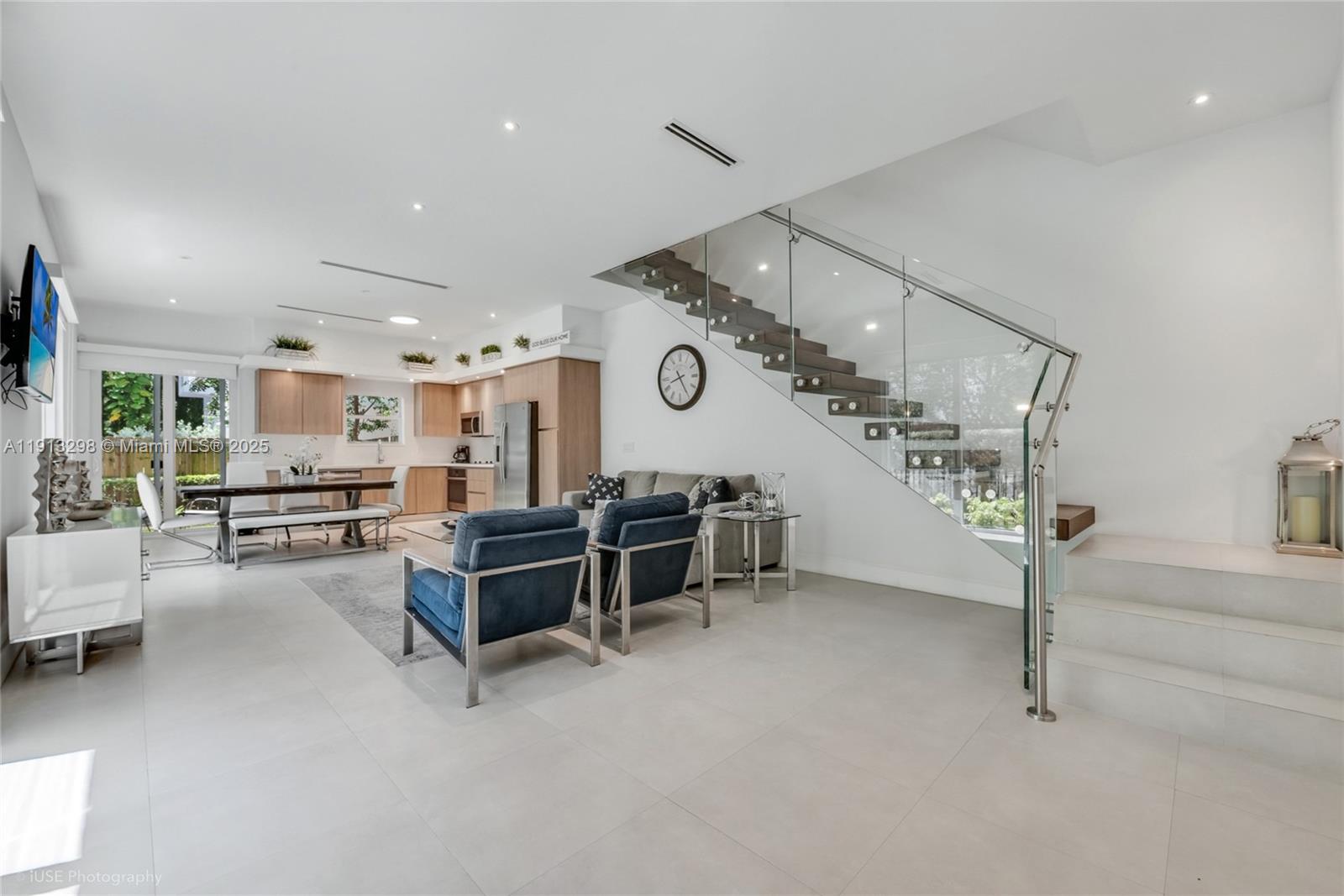 a living room with furniture and a clock