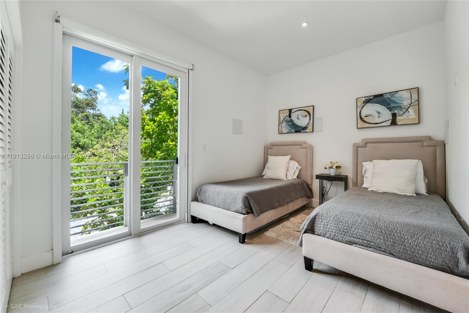 2868 Southwest 33rd Court, Unit 2868 Miami, FL 33133 - Photo 11 of 15 a bedroom with two beds and a large window