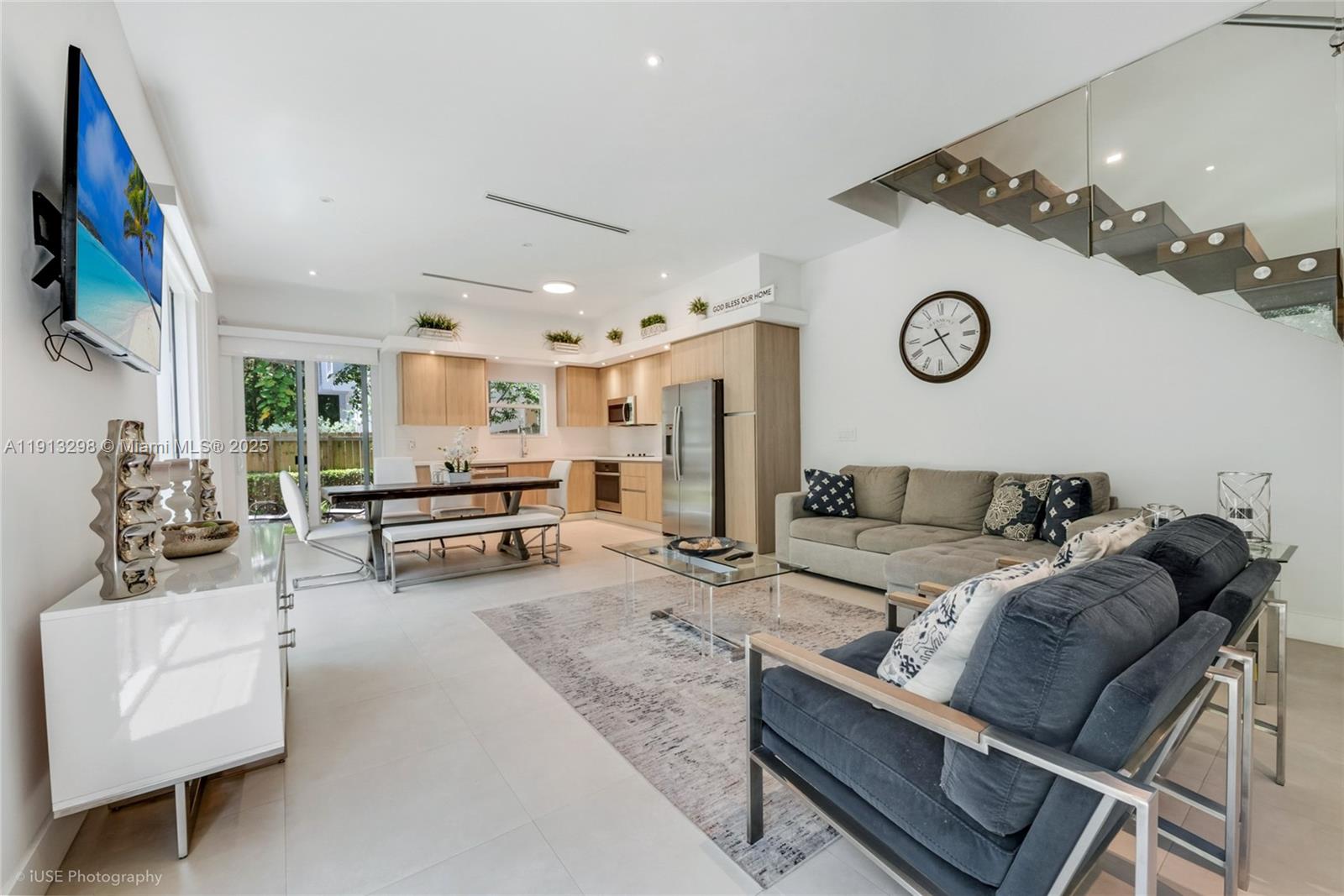 2868 Southwest 33rd Court, Unit 2868 Miami, FL 33133 - Photo 2 of 15 a living room with furniture and a clock