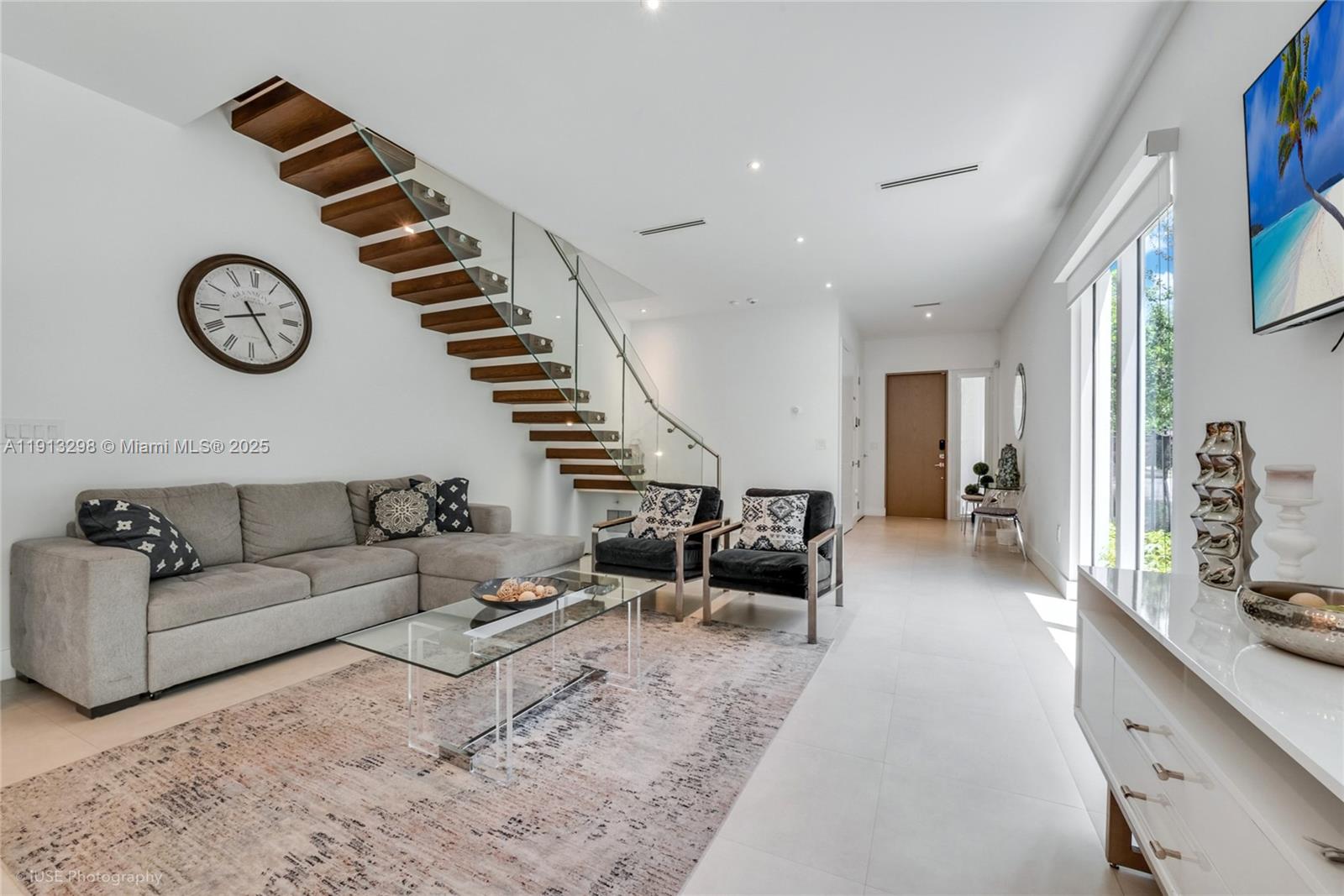 2868 Southwest 33rd Court, Unit 2868 Miami, FL 33133 - Photo 3 of 15 a living room with furniture and a large window