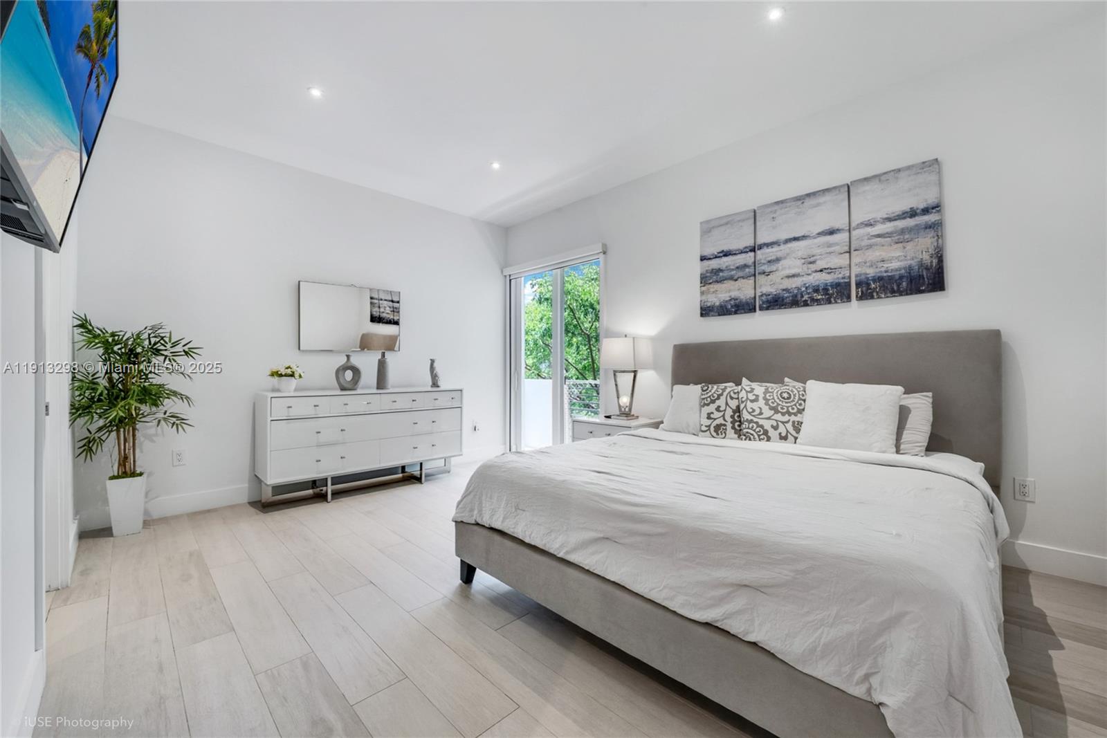 2868 Southwest 33rd Court, Unit 2868 Miami, FL 33133 - Photo 6 of 15 a bedroom with a bed and a potted plant