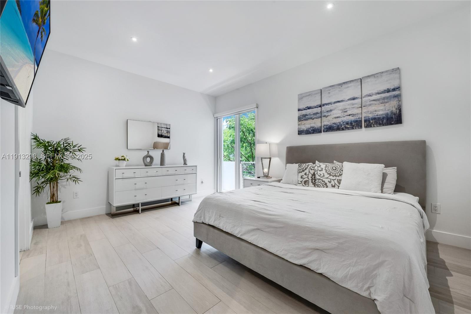 2868 Southwest 33rd Court, Unit 2868 Miami, FL 33133 - Photo 6 of 15 a bedroom with a bed and a potted plant