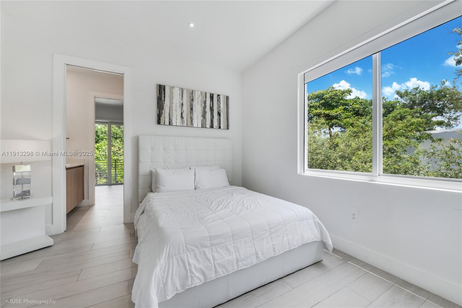 2868 Southwest 33rd Court, Unit 2868 Miami, FL 33133 - Photo 8 of 15 a bedroom with a large bed and a window