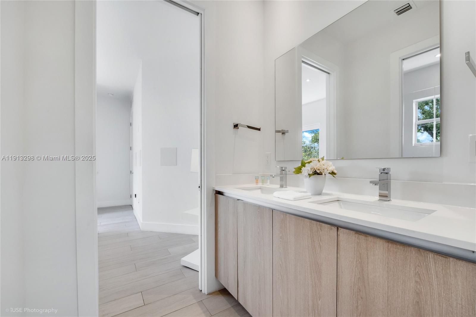 2868 Southwest 33rd Court, Unit 2868 Miami, FL 33133 - Photo 10 of 15 a bathroom with a sink and a mirror