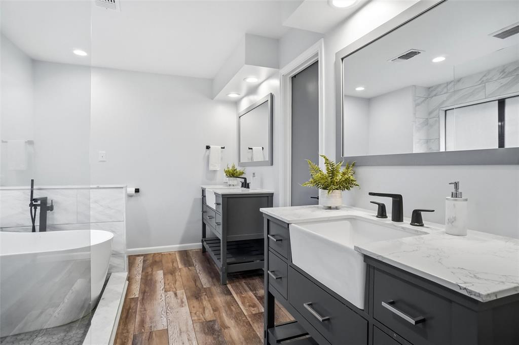 2613 Stone Hollow Drive Bedford, TX 76021 - Photo 14 of 33 a bathroom with a sink and a bathtub