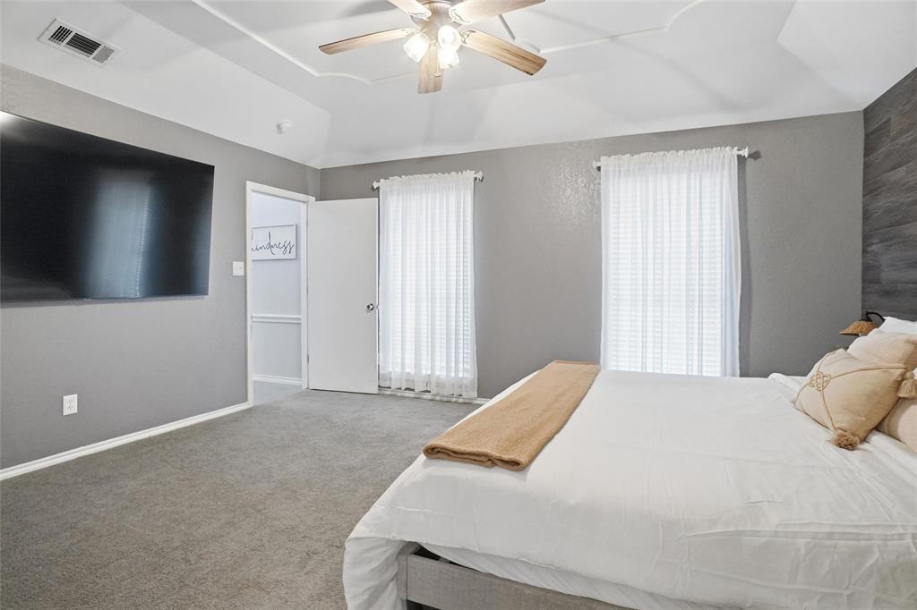 2613 Stone Hollow Drive Bedford, TX 76021 - Photo 18 of 33 a bedroom with a bed and a flat screen tv