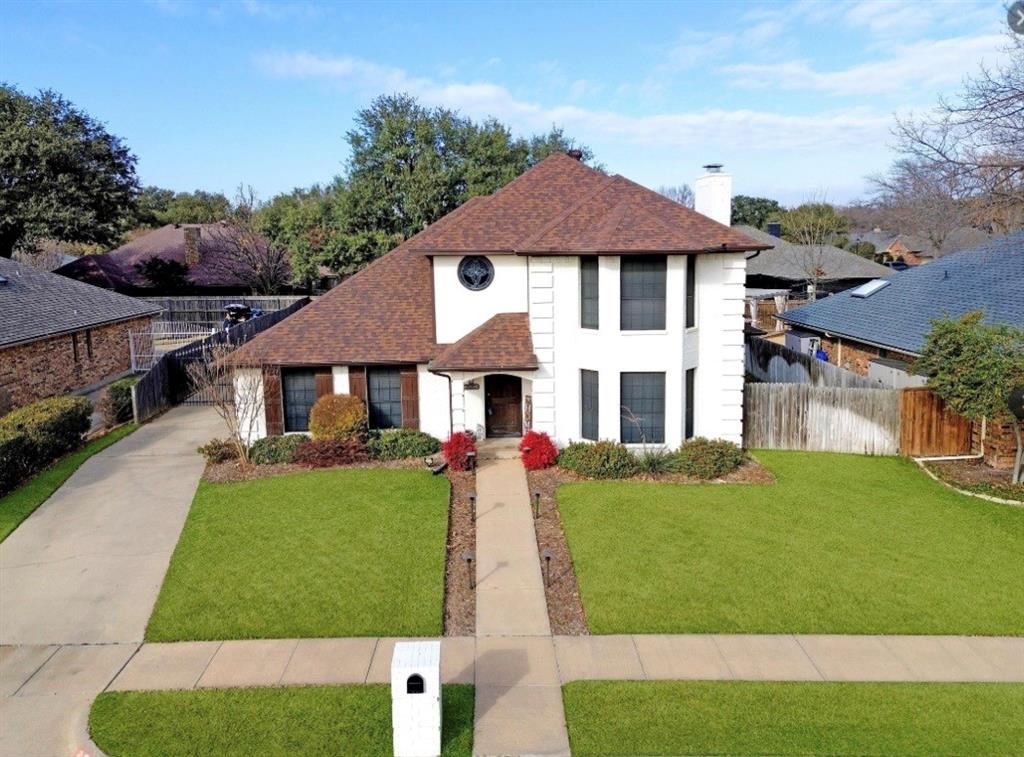 2613 Stone Hollow Drive Bedford, TX 76021 - Photo 2 of 33 a front view of a house with a yard