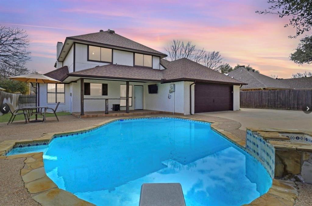 2613 Stone Hollow Drive Bedford, TX 76021 - Photo 23 of 33 a view of a house with pool and chairs