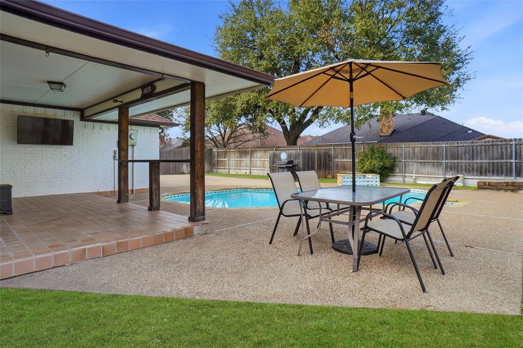 2613 Stone Hollow Drive Bedford, TX 76021 - Photo 25 of 33 a view of a backyard with a patio and outdoor seating