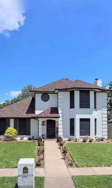 2613 Stone Hollow Drive Bedford, TX 76021 - Photo 27 of 33 a front view of a house with a garden