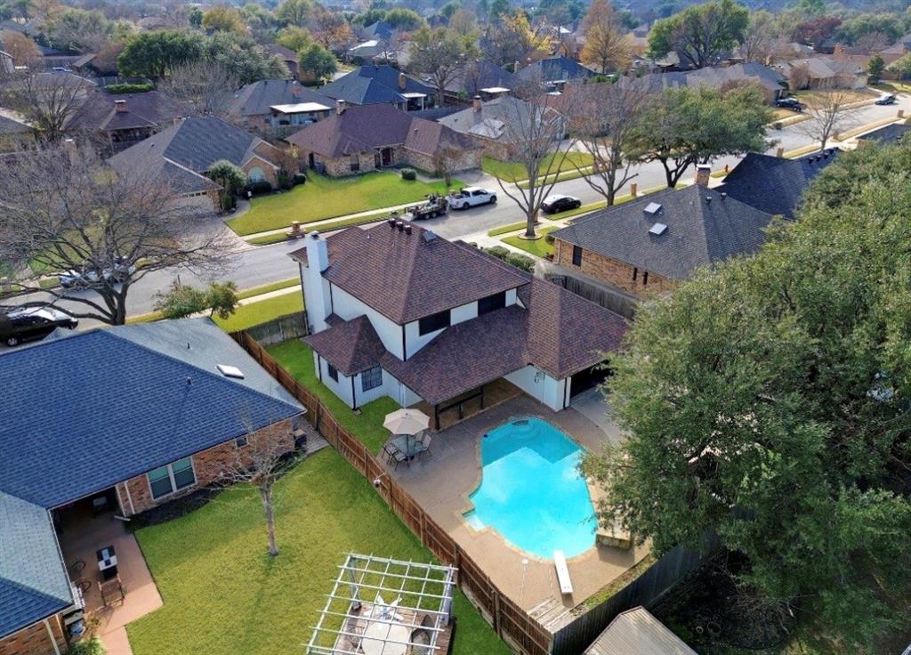 2613 Stone Hollow Drive Bedford, TX 76021 - Photo 31 of 33 an aerial view of a house with a swimming pool
